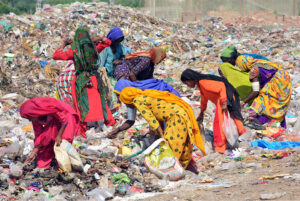 Gypsy women busy in searching the valuables items from garbage at Latifabad