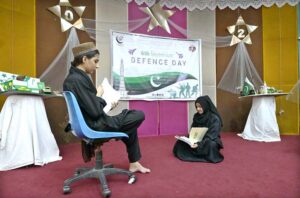 Students showcase their taekwondo skills during a ceremony held in connection with Defense Day at Khubaib Girls School and College.