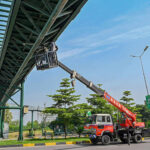 Engineers use a crane to repair CCTV cameras at Shakar Parian Chowk in federal capital