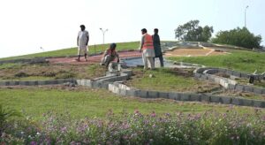 CDA workers busy in fixing cemented blocks for preparing Pakistan Map on greenbelt at Zero Point.