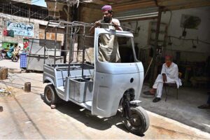 A worker preparing rickshaw body at his workplace Goods Naka Road