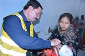 . A health worker administering polio drops to a child during 7-days Pakistan Polio Eradication Programme 2024 in the city.