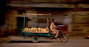 - A hardworking vendor through Saidpur Road, selling fresh bananas on his tricycle.