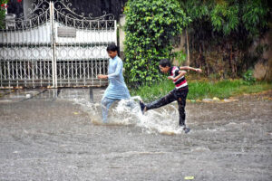 WASA MD Orders Rapid Drainage: Staff in action to prevent flooding after heavy rains, ensuring effective water management in Provincial Capital.