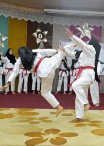Students showcase their taekwondo skills during a ceremony held in connection with Defense Day at Khubaib Girls School and College.