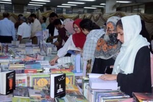 Students taking keen interest in books at a stall during the 5 days “Book Fair” at University of Agriculture Faisalabad (UAF) .