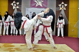 Students showcase their taekwondo skills during a ceremony held in connection with Defense Day at Khubaib Girls School and College.