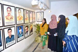 Visitors are keenly viewing pictorial exhibition after inaugurating at FAC Art Gallery to mark Pakistan Defense Day