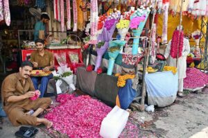A vendor at Bani Road presents a dazzling variety of colorful lights to attract customers