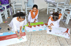 Students participating in painting competition on the occasion of Pakistan Defense Day in a local school at Latifabad