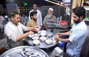 A vendor is serving the traditional, popular falooda at Monument Chowk, offering a unique taste of a beloved local sweet dish.