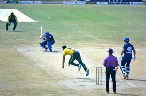 Cricket players in action during the one-day Champions’ Cup 2024 match between the Panthers and Lions teams at Iqbal Stadium