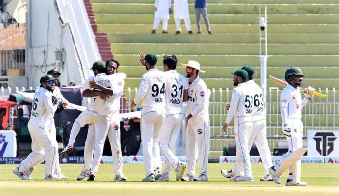 Pakistani players celebrate after taking the wicket of Bangladeshi batsman Mominul Haque during the 3rd day of the 2nd Test match between Pakistan and Bangladesh at the Rawalpindi Cricket Stadium