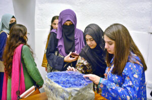 Students immerse in the art exhibition at the PHA Art Gallery inside Nasir Bagh.