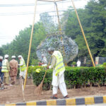 PHA workers busy cleaning green belt in the Provincial Capital