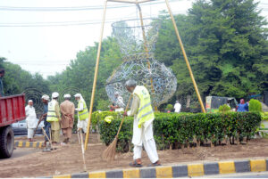 PHA workers busy cleaning green belt in the Provincial Capital