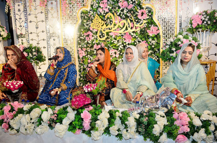 A group of female Naat Khawan reciting Naat during a Mehfil-E-Milad organized by the PPP Women Wing