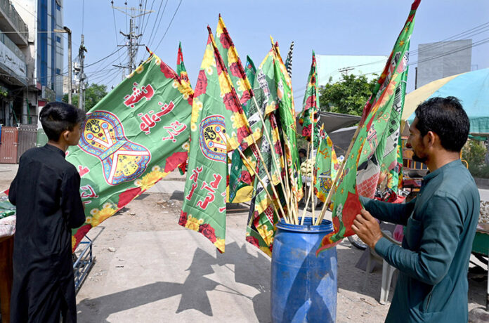 A vendor displays decorative items in connection of Eid Milad-un-Nabi (PBUH) as Muslims celebrate Eid Milad un Nabi, the birthday celebration of prophet Hazrat Muhammad (PBUH) on the 12th day of Rabi’ al-awwal in the city