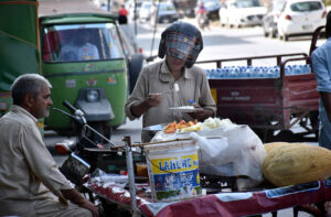 September 11 - A vendor selling unhygienic seasonal honey melon (Garma) on a roadside handcart that pose health risks for customers.