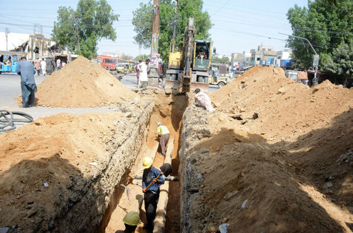 Machinery in use to repair the pipeline of Pak-Arab Refinery Company Ltd at Korangi Road