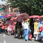 A large group of female tourists explores the beauty of the walled city during a guided tour organized by 101 Historical Education Tours of Pakistan at Anarkali Bazaar