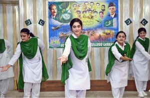 Student performing in a tableau to mark the Pakistan Defense Day at Government Girls Degree College