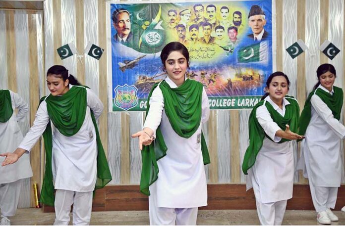 Student performing in a tableau to mark the Pakistan Defense Day at Government Girls Degree College