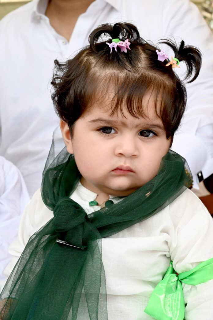 A minor girl participating in the the Eid Milad Un Nabi (PBUH) procession on its way at G-7