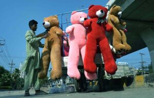A roadside vendor display large, adorable soft toys, aiming to capture the attention of passers-by in the Twin Cities.