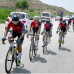 Cyclists participating in a Cycle Race from Karachi to Jhampir on National Highway on the eve of Defense and Air Force Day organized by SSGC near Jhirk