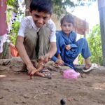 Children are playing with marble at Old Civil Line