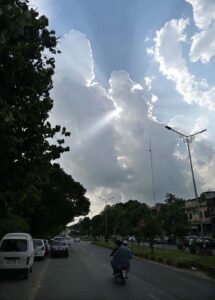 An attract view of sunrays peeping through clouds hovering over the skies of Federal Capital