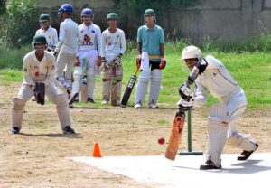 Youngsters cricketers in action during PCB under 16th team trails for inter school tournament at Govt; comprehensive higher secondary school ground.