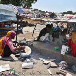 A gypsy woman preparing bread for her family at makkis area