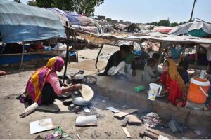 A gypsy woman preparing bread for her family at makkis area