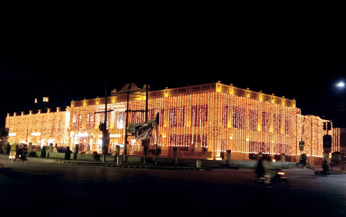 The building shines with fancy lights in honor of Rabi-ul-Awwal