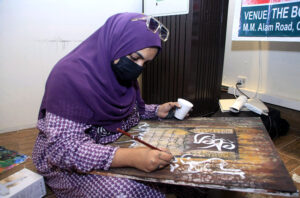 A student adds the final strokes to her calligraphy masterpiece under the mentorship of the Knowledge of Art Academy at The Fortnight School System.