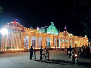 The building shines with fancy lights in honor of Rabi-ul-Awwal