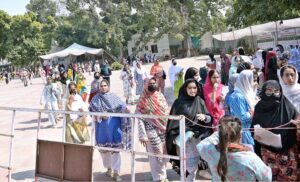 Students leaving Sargodha University after participating in the medical entrance test (MCAT).