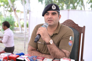 SP Headquarters Ziaullah addresses a press conference during a ceremony at Police Line, where stolen property is handed over to its rightful owners