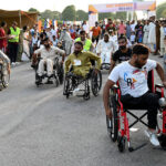 Disabled individuals participate in the 8th edition of the 'Save Tomorrow' Run & Walk, highlighting the issue of drug abuse in society, hosted by the Karim Khan Afridi Welfare Foundation (KKAWF) at Fatima Jinnah Park (F-9) in the Federal Capital