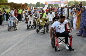 Disabled individuals participate in the 8th edition of the 'Save Tomorrow' Run & Walk, highlighting the issue of drug abuse in society, hosted by the Karim Khan Afridi Welfare Foundation (KKAWF) at Fatima Jinnah Park (F-9) in the Federal Capital