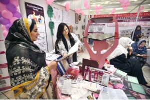 A woman displaying her creations on her stall during the Education Expo 24.