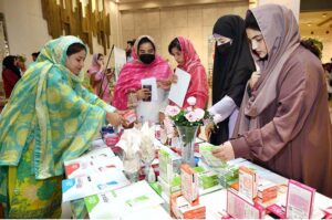 Female visitors show interest in a pharmaceutical stall during World Pharmacists Day, organized by the Young Pharmacists Community Pakistan.