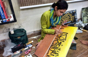A student adds the final strokes to her calligraphy masterpiece under the mentorship of the Knowledge of Art Academy at The Fortnight School System.