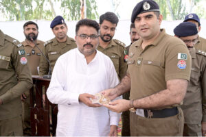 SP Headquarters Ziaullah addresses a press conference during a ceremony at Police Line, where stolen property is handed over to its rightful owners