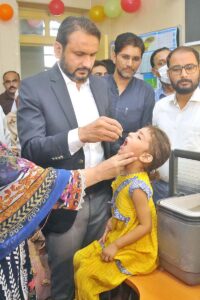 Deputy Commissioner Waseem Hamid Sindhu is administering polio drops to a child during the inauguration of the 3-days Anti-Polio Campaign.
