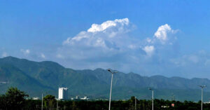 A mesmerizing view of the federal capital with clouds hovering over the mountains