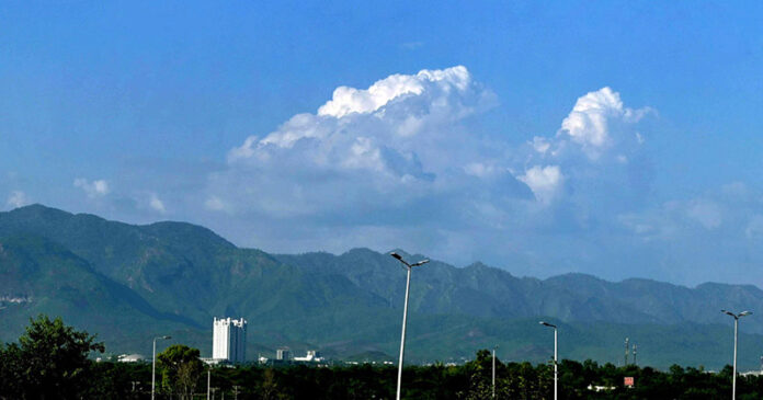 A mesmerizing view of the federal capital with clouds hovering over the mountains