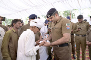 SP Headquarters Ziaullah addresses a press conference during a ceremony at Police Line, where stolen property is handed over to its rightful owners